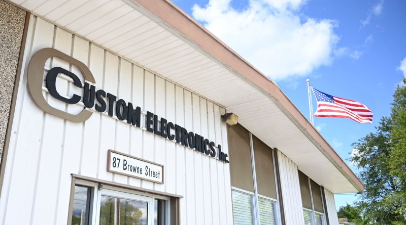 CUSTOM ELECTRONICS, INC. (CEI) DELIVERS AS9100-CERTIFIED QUALITY FOR AEROSPACE AND MILITARY BATTERY SOLUTIONS CEI - AS9100 Certification_Custom Electronics Building